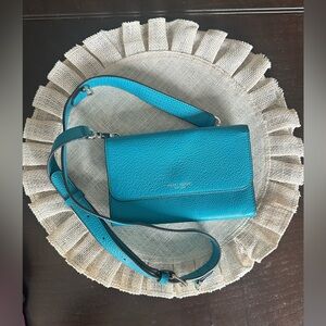 Henri Bendel New York turquoise crossbody bag.